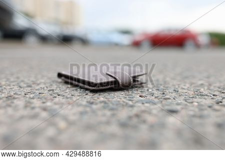 Lost Leather Wallet Lies On Road Closeup