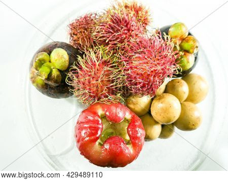 High Angle. Thai Fruits, Rose Apple, Rambutan, Mangosteen, Lansium Demesticum, On A Clear Glass Cup,
