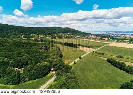 Aerial View Of Beautiful Landscape In Mountains With Forest And Fields. Sleza Mountain Near Wroclaw 