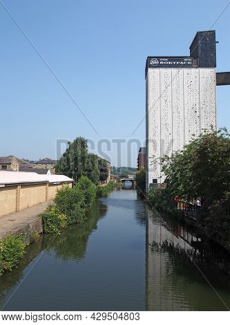 Brighouse, West Yorkshire, United Kingdom - 21 July 2021: Riverside View Of Brighouse Town With The 