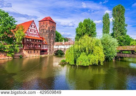 Nuremberg, Germany. Colourful And Picturesque View Of The Half-timbered Old Houses On The Banks Of T