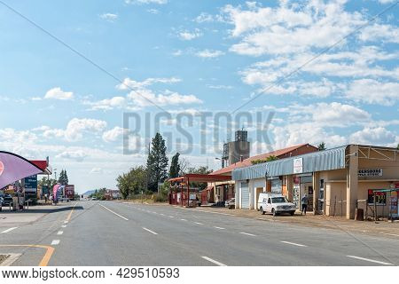 Reddersburg, South Africa - April 23, 2021: A Street Scene, With Businesses, People And Vehicles, In