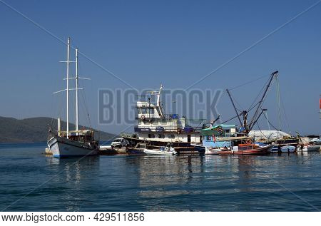 Boats and yachts at the in the marina of village  Akyaka - slow city in Turkey.August 1,2021. Mugla,Turkey