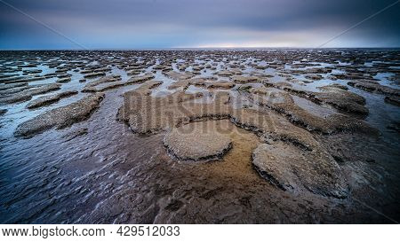 Panoramic View Over The Tidal Flats Along The Shore Of The Netherlands With Wadden Sea In Distance A