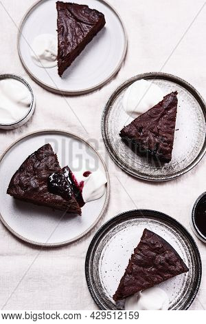 Slices Of Rich Moist Chocolate Cherry Cake. Homemade Dark Chocolate Sweet Brownies Cakes With Ice Cr