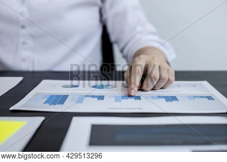 Close-up Pressing A White Calculator, A Female Auditor Using A Calculator To Verify The Accuracy Of