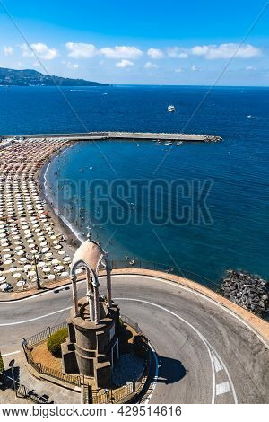 Sorrento, Italy - August 26 2020: Small Beach Full Of Colorful Sunbeds And Umbrellas