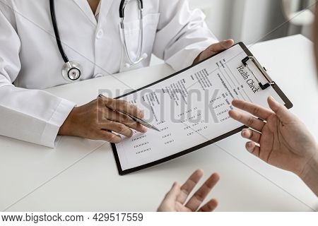 The Doctor And The Patient Are Discussing The Details Of The Treatment, The Results Of The Physical 
