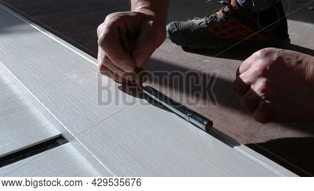 Marking The Location Of Fasteners On The Door Leaf By The Hands Of An Assembler With A Pencil, Apply