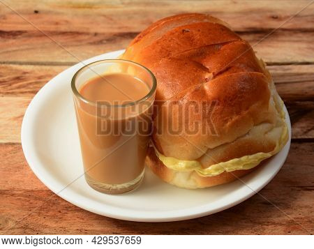 Indian Masala Chai With Bun Maska Bread On White Plate, Selective Focus