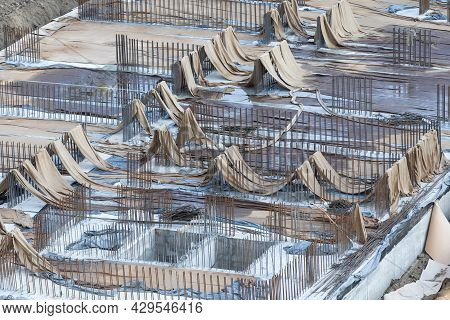 Closeup Of House Foundation Made From Concrete Shuttering Blocks Filled With Mortar And Reinforcemen