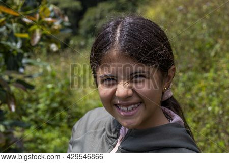 Hispanic Girl Smiling In The Country Side