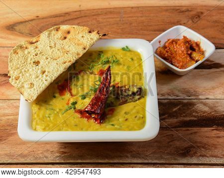 Dal Khichdi Or Khichadi, Tasty Indian Recipe Served In Bowl Over Rustic Wooden Background, The Food 