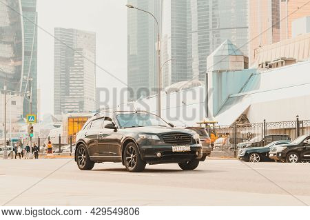 Infiniti Fx35 First Generation In The City Street. Front Side View Of Black Crossover Suv Riding On 