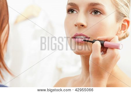 Applying Pink Lipglass