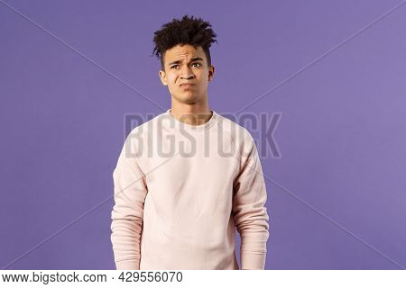 Portrait Of Young Reluctant And Displeased Man Having Hesitating, Unwilling To Go Somewhere, Dont Ha