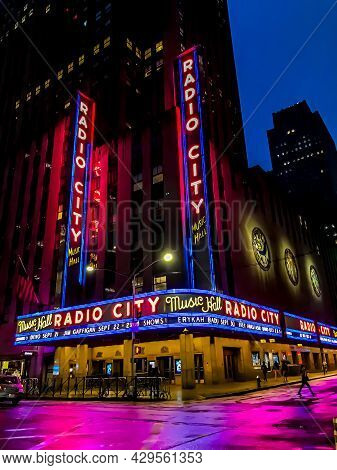 Exterior Of The Iconic Radio City Music Hall Theatre (home Of The Rockettes) With Colorful Neon Marq