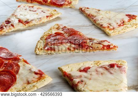 New York Style Pizza Slices On Marble Kitchen Table
