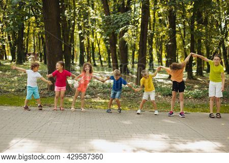 Kids Playing Outdoor Team Building Games At Daycare