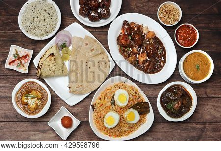 Assorted Indian Food On Wooden Background. Dishes And Appetizers Of Indian Cuisine