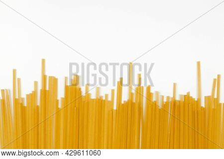 Uncooked Spaghetti, White Background. Bunch Of Italian Pasta Top View, Flat Lay.