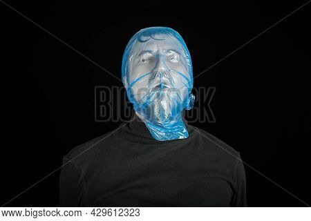 Blue Garbage Bag On Man Head. Exit Bag For Suicide. Self-asphyxiation Concept. Suicide Bag On Man He