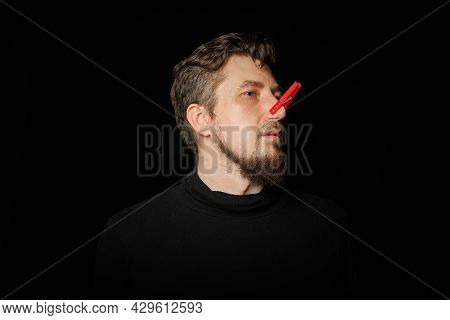 Bearded Man With Clothespin On Nose. Bad Stink, Funny Prankster, Joke Concept. Laugh At Yourself. Re