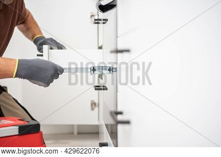 Kitchen Cabinets Drawer Move Testing By Professional Cabinetmaker Close Up Photo. White Clean And Mo