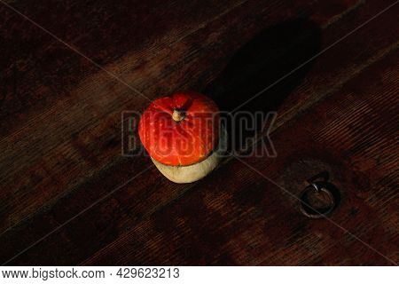Flat Lay Top View Turban Squash, Cucurbit On Dark Red Old Wooden Background. Turkish Pumpkin With A 