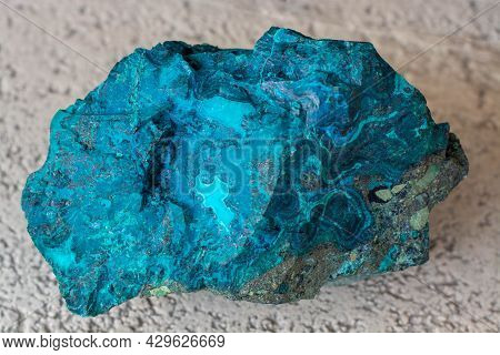 Copper Ore From A Copper Mine In Chile, A Green Stone On A White Background.
