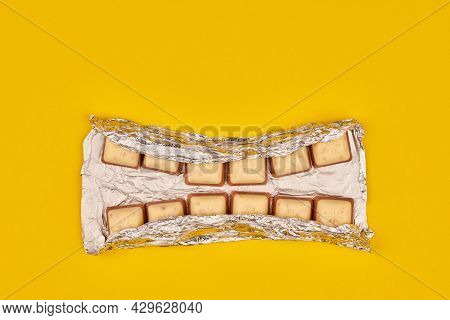 Kaliningrad, Russia - 03.27.2021 - Schogetten Chocolate In Foil As Dental Teeth Concept. Delicious G