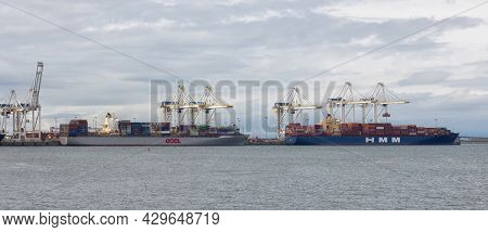 Tsawwasen, Greater Vancouver, Bc, Canada - August 07, 2021: Big Container Ships Are Being Loaded At 