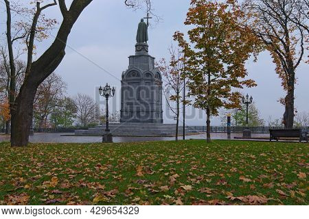 Low Angle View Of Majestic Autumn Colored Volodymyr Hill (vladimirskaya Girka). Fallen Orange Leaves