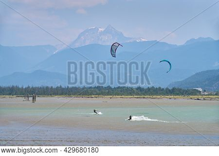 Squamish, British Columbia, Canada - July 28, 2018. Howe Sound Kite Surfing. Kiteboarders And Windsu