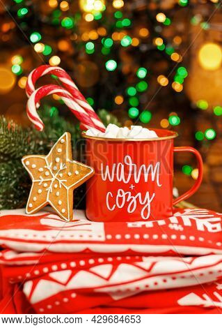 Hot Chocolate Infront Xmas Tree. Merry Christmas Greeting Card. Christmas Cappuccino In Red Mug On R