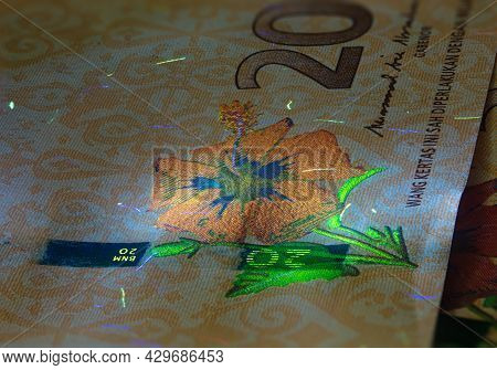 Macro Photography Of 20 Malaysian Ringgit With Fluor Light. Extreme Close-up Of Rm20 Malaysia. Sharp