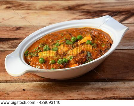 Matar Paneer Masala Recipe Made Using Cottage Cheese, Green Peas, Served Over A Rustic Wooden Backgr