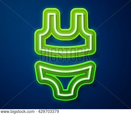 Glowing Neon Line Summer Beach Swimsuit Icon Isolated On Blue Background. Beach Women Fashion. Vecto