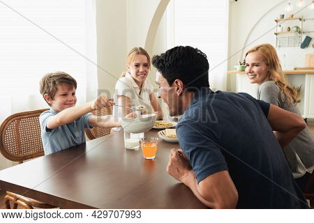 Happy Caucasian Family Talking To Each Other During Breakfast Together At Home. Father Mother Talk T