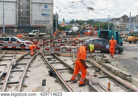 Zurich, Switzerland, July 10, 2017: Road Workers Repair The Street With A Tramline In The City Cente