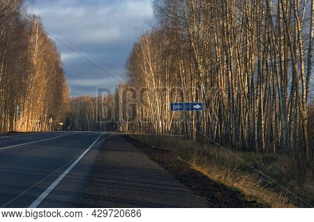 Highway Between The Birches And Road Sign With Inscription In Russian 