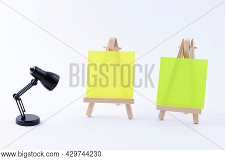Two Wooden Easels Miniature With Blank Colored Square Canvas Or Memo Paper - Mockup. Mini Wooden Sta