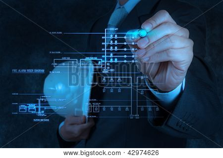 Engineer Draws An Electronic Single Line And Fire Alarm Riser Schematic