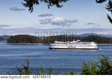Victoria, Vancouver Island, British Columbia, Canada - August 8, 2021: Bc Ferries Boat Leaving The T