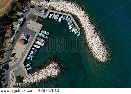 Aerial Drone View Of Fishing Boats And Tourist Yachts Moored At The Marina. Pomos Harbor Paphos Cypr