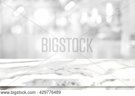 Empty White Table Top, Counter, Desk Over Blur Perspective Store With Bokeh Light Background, White 