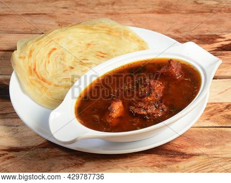 Kerala Paratha / Parotta, Layered Flat Bread Made From Maida Or Whole Wheat Flour. Served With Spicy