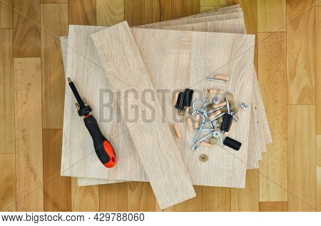 Chipboard Sheets, Tools And Parts For Assembly Of Cabinet Furniture. Self-assembly Of Furniture At H