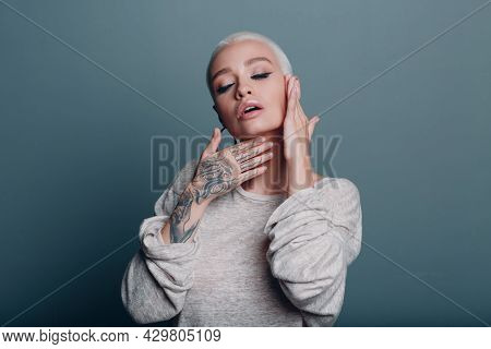 Millenial Young Woman With Short Blonde Hair Portrait Doing Face Yoga Self Facebuilding Massage For 