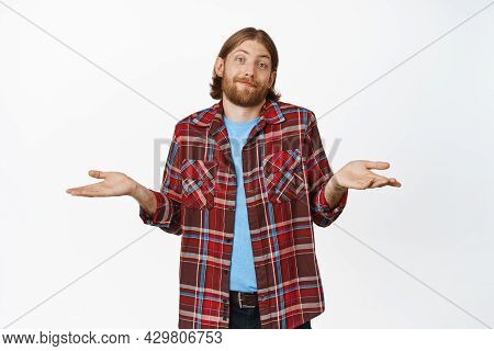 I Dont Know. Clueless Handsome Guy Smirk, Shrugging Shoulders With Hands Spread Sideways, Has No Ide
